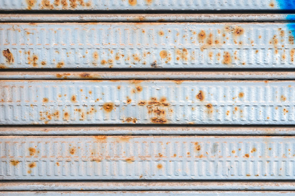 Close Up Texture Of Old Rusted Garage Door