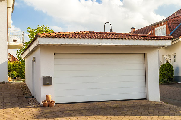 detached garage with a white garage door