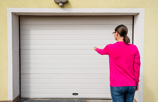 women opening garage door