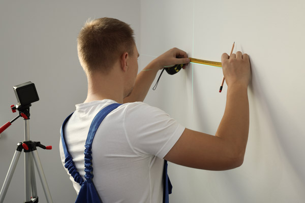 Worker Using Cross Line Laser