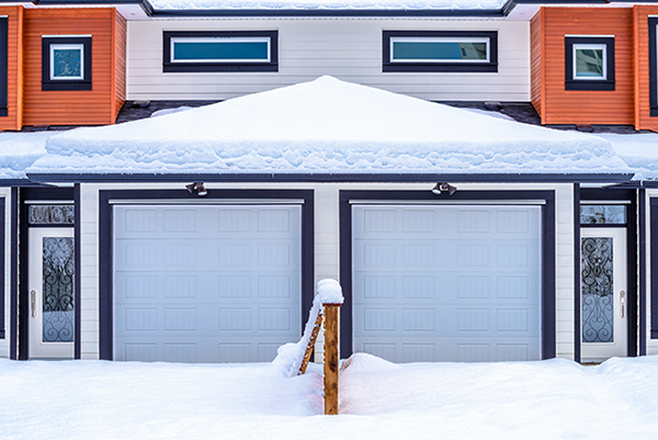 snow on top of a garage roof