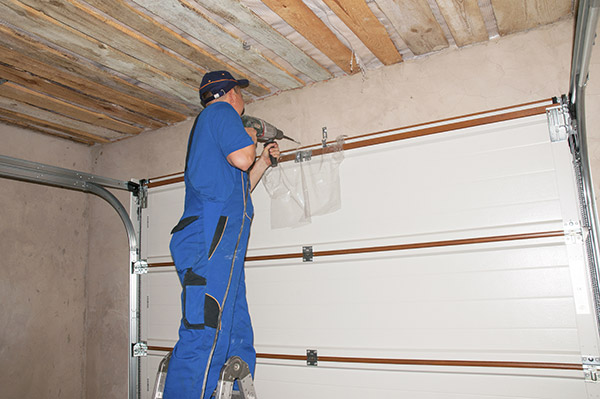 garage door getting installed by an installer